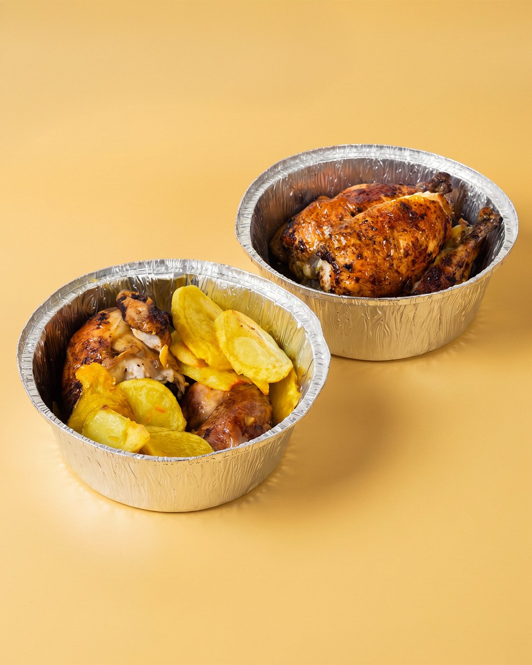 Pollo asado y patatas preparados para llevar